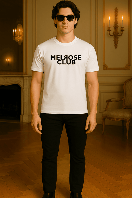 Man wearing Melrose Club signature t-shirt white with black logo and black pants indoors