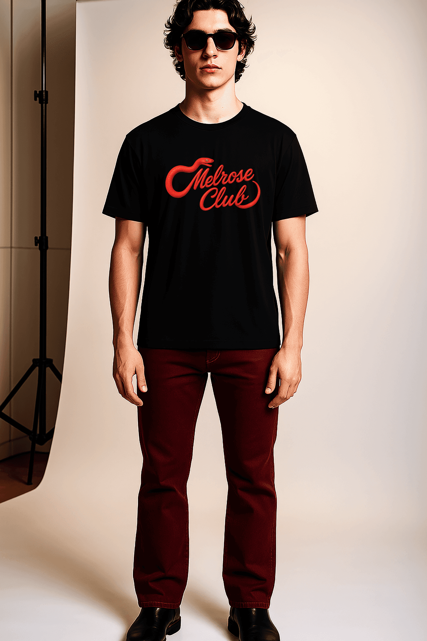 Melrose Club Venom Script graphic tee in black with bold red lettering displayed on model